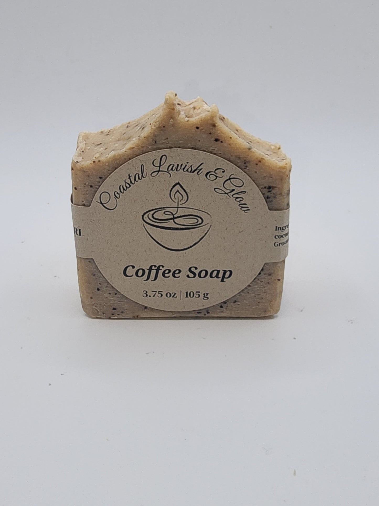 Bar of coffee soap with a label on a white background