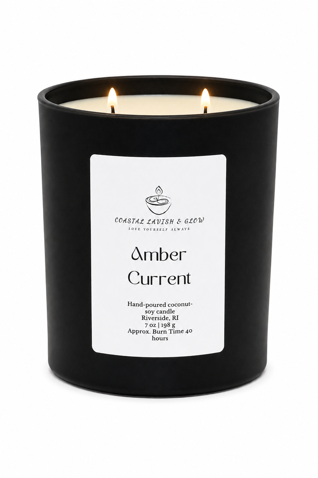 "Amber Current" candle in a black jar with 2 lit wicks