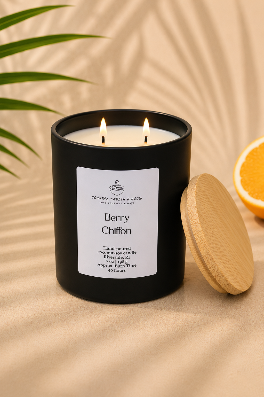 "Berry Chiffon" black candle with a label on a beige background