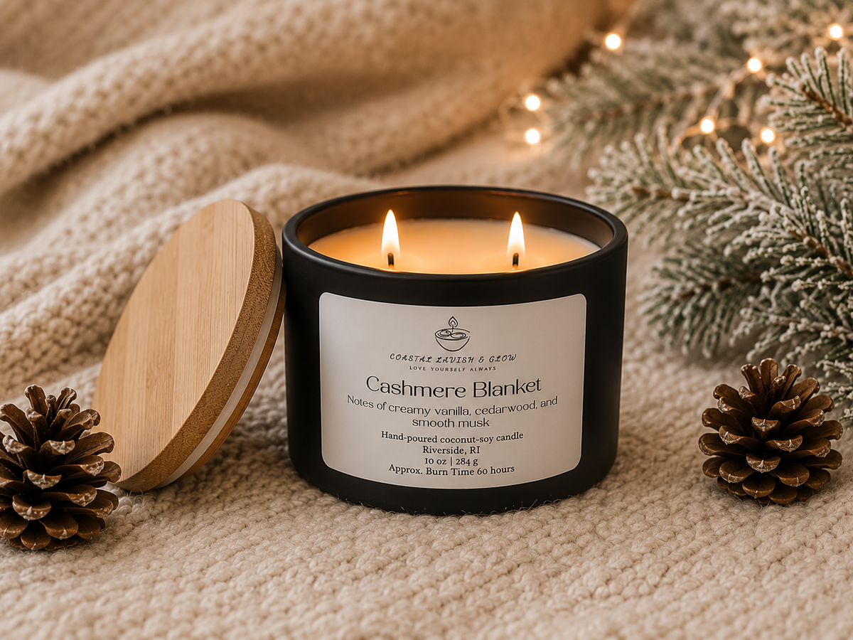 "Cashmere Blanket" candle with wooden lid on a textured surface with decorative elements