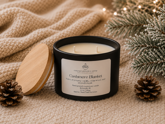 "Cashmere Blanket" candle with a label on a textured surface with decorative element