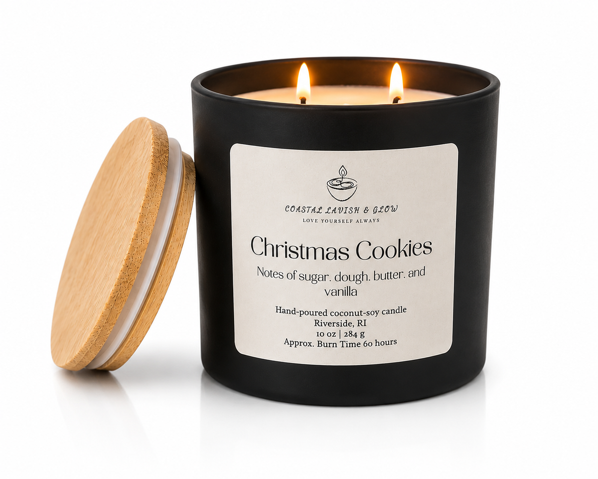 Black candle labeled 'Christmas Cookies' with a wooden lid on a white background