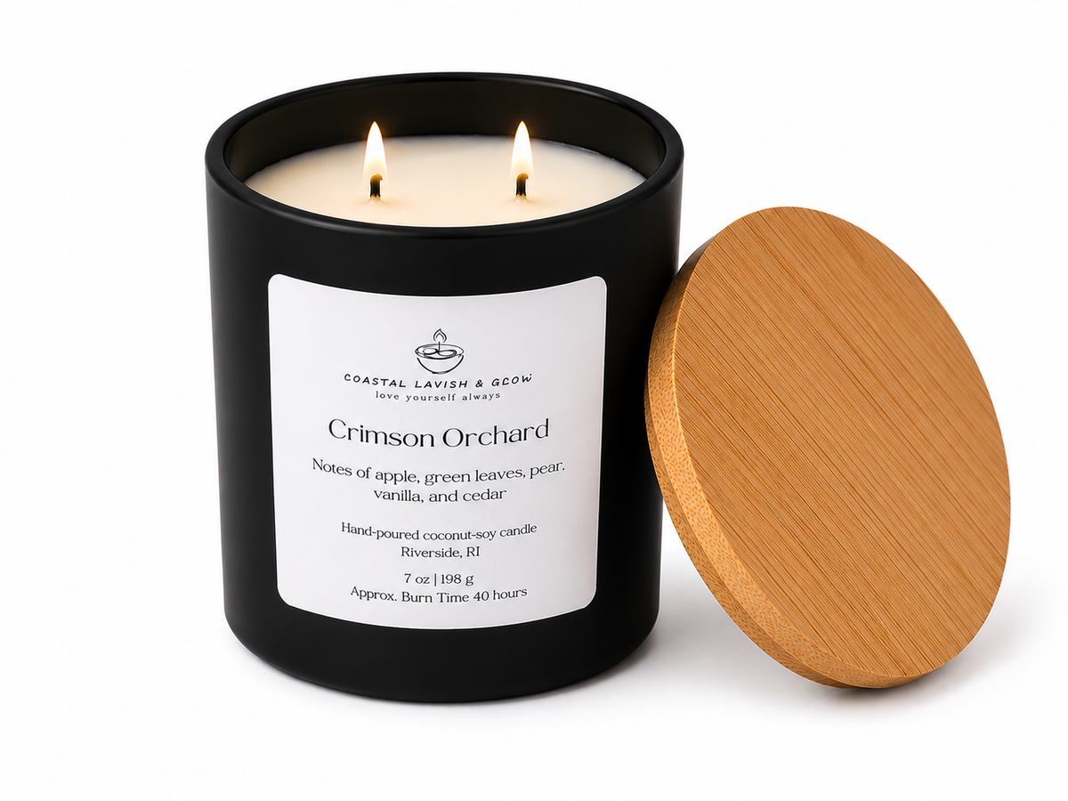Black candle jar with wooden lid labeled 'Crimson Orchard' on a white background