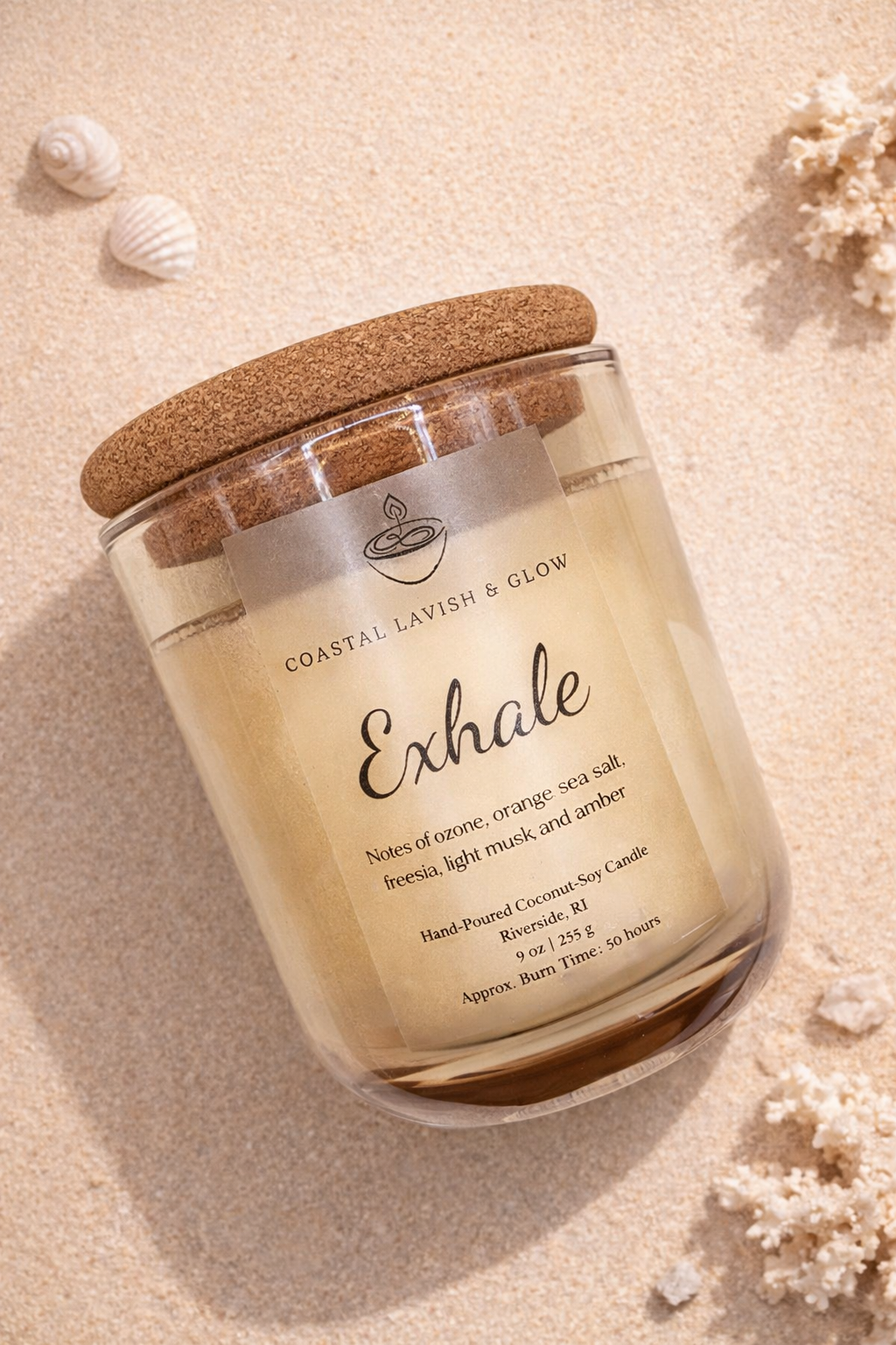 'Exhale' candle with a cork lid on a sandy background - sea salt, freesia, light musk, and amber scent.