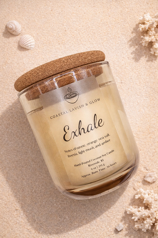 'Exhale' candle with a cork lid on a sandy background - sea salt, freesia, light musk, and amber scent.