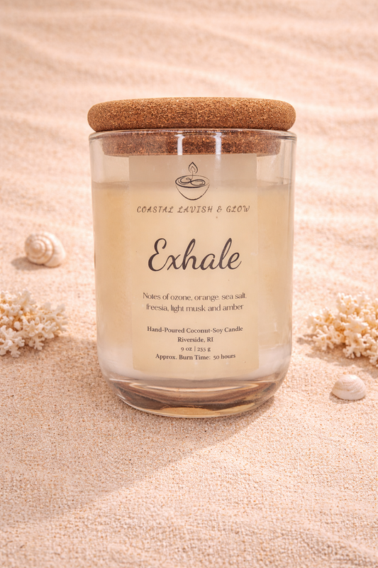 'Exhale' candle with a cork lid on a sandy background - sea salt, freesia, light musk, and amber scent.