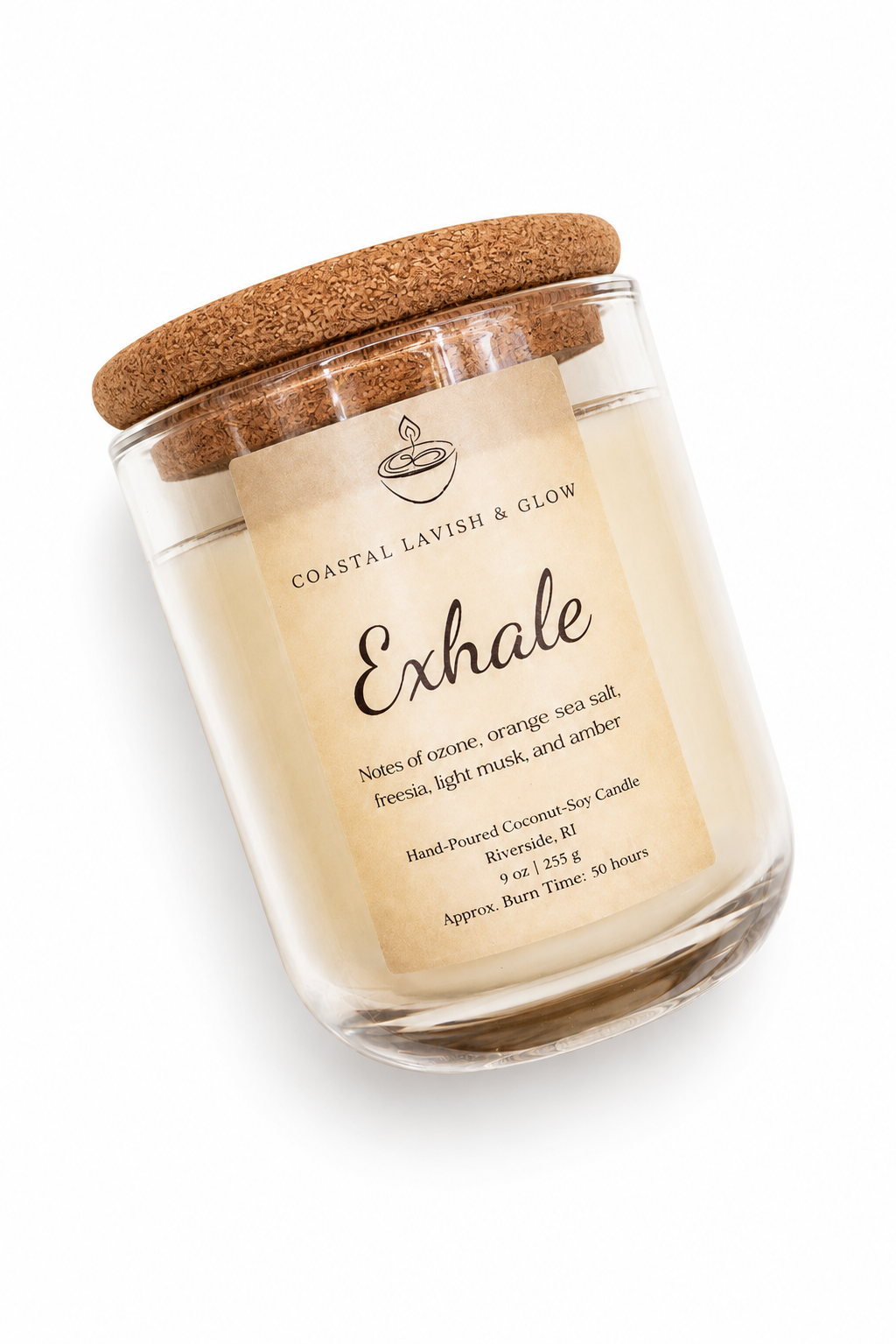Glass candle with cork lid labeled 'Exhale' on a white background