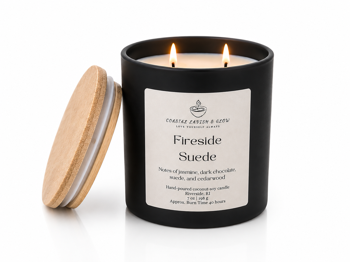 "Fireside Suede" candle in a black container with a wooden lid on a white background