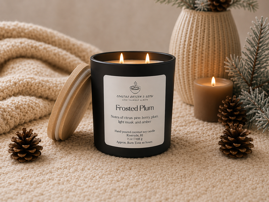 Frosted Plum candle with decorative elements on a neutral background