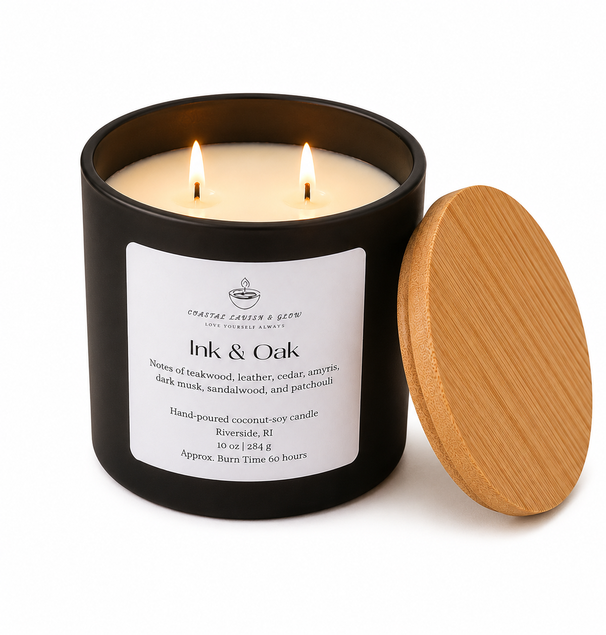 Candle in a black container with a wooden lid, labeled 'Ink & Oak', on a white background.