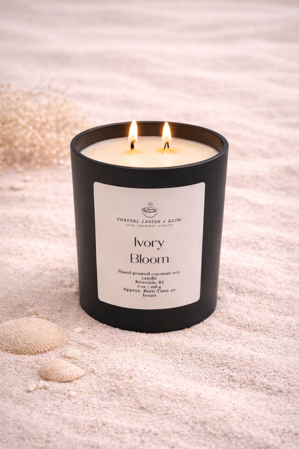 Ivory Bloom Candle on a beachy background - vanilla-scented candle that also contains notes of green leaves, jasmine, sandalwood, musk scent