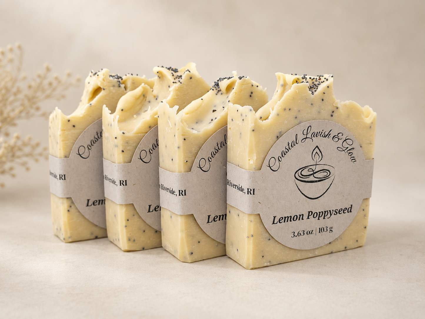 Four bars of Lemon Poppyseed soap with visible branding on a neutral background