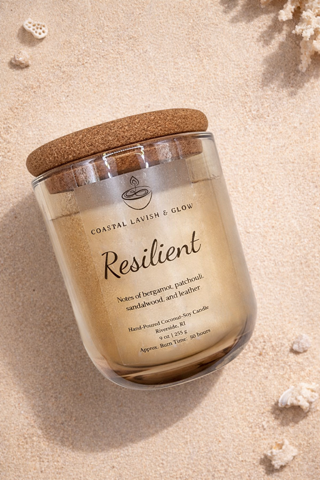 'Resilient' candle on a sandy background - Bergamot, Patchouli, Sandalwood, and Leather Scent