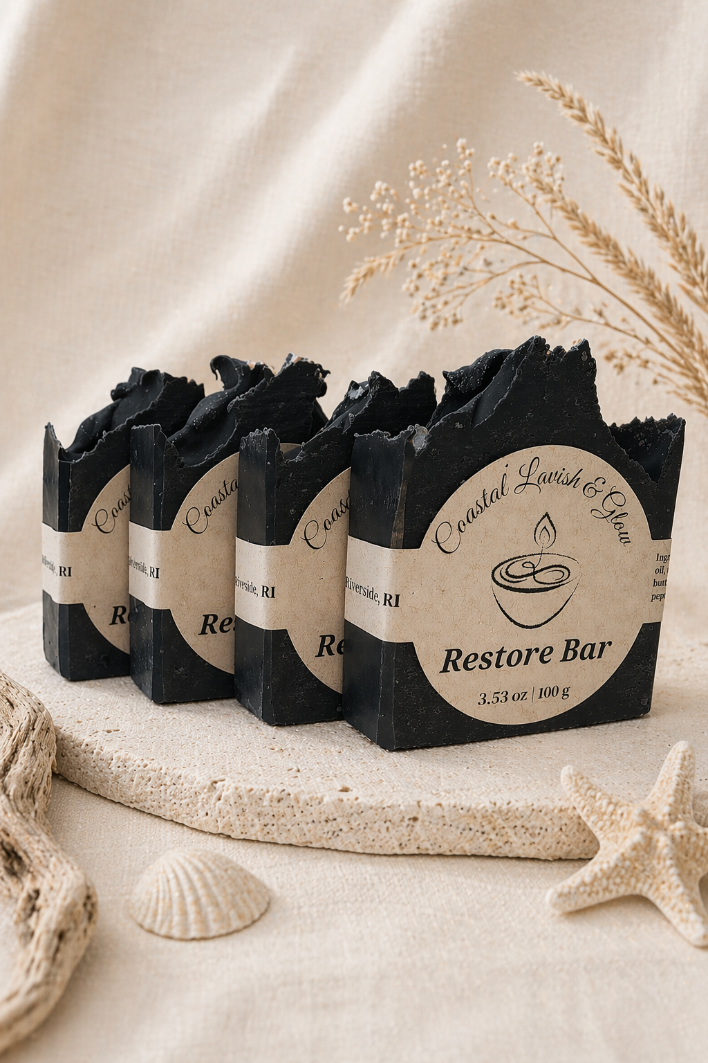Restore Bar Handcrafted Soap with Activated Charcoal scented with peppermint, rosemary, and patchouli on a cream background