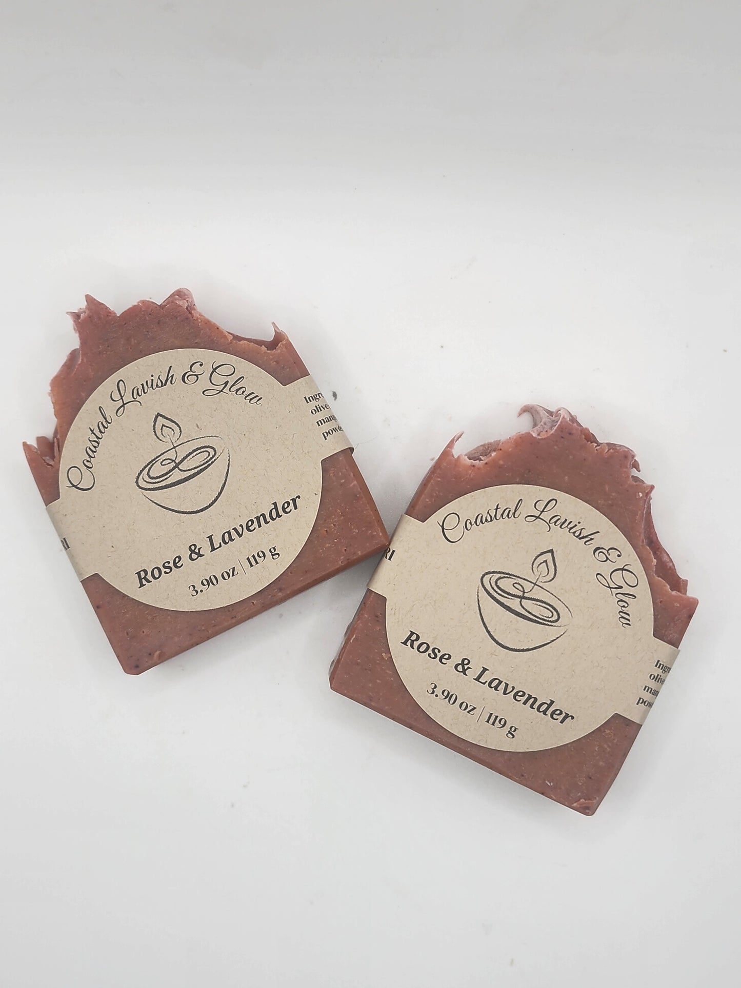 Two soap bars with labels on a white background
