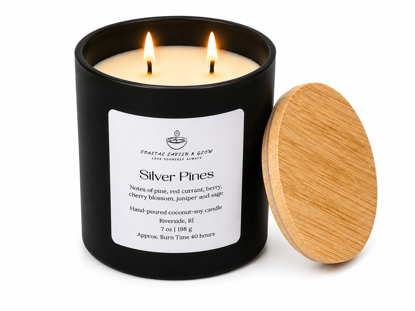 Black candle with wooden lid labeled 'Silver Pines' on a white background