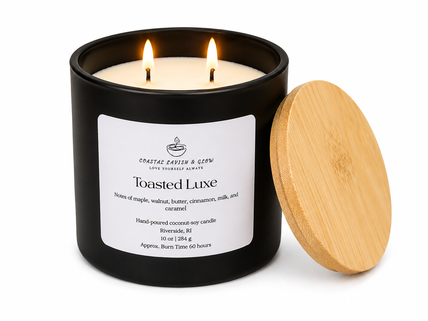 Black candle jar with ' Toasted Luxe' label and wooden lid on a white background