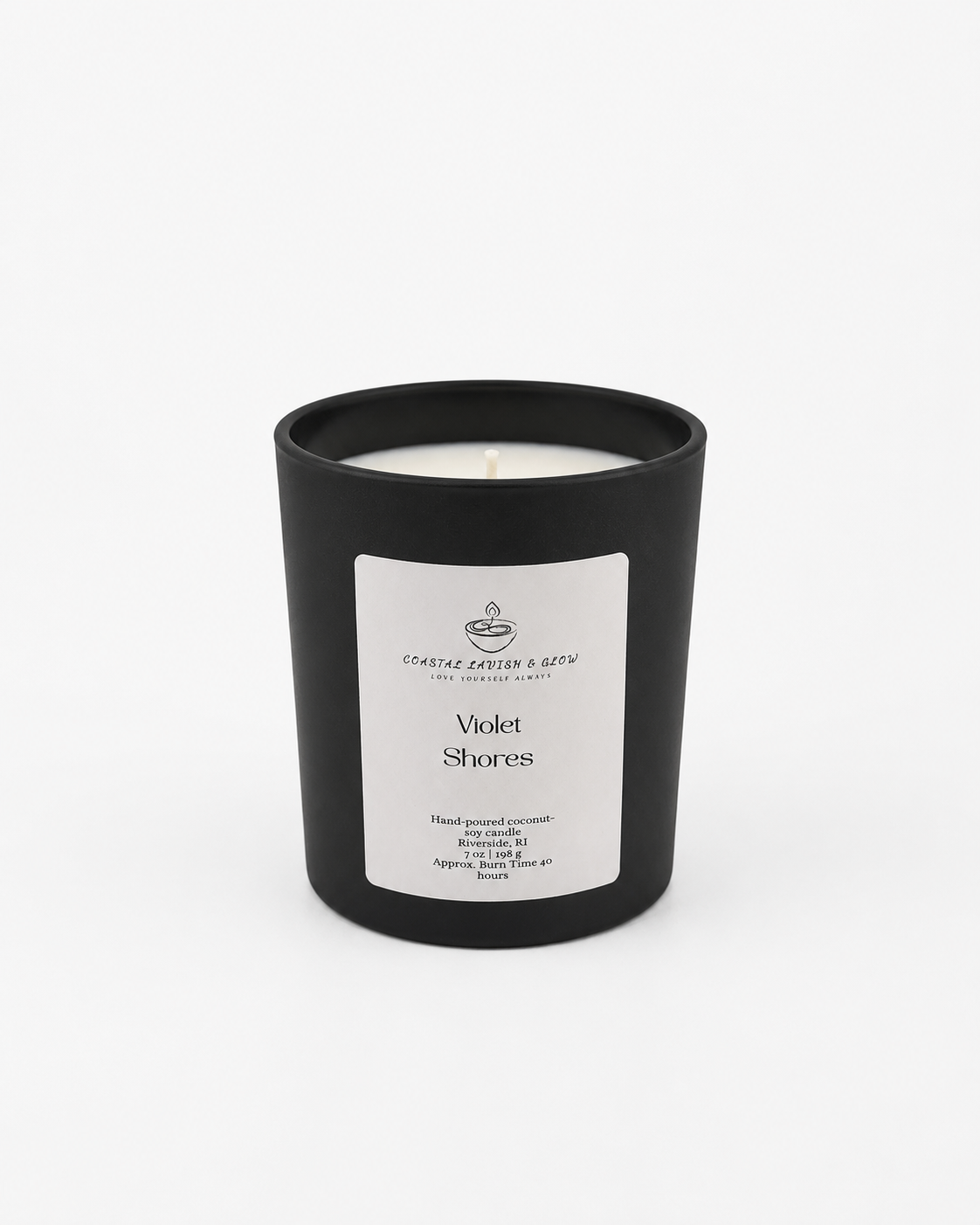 Black candle with a white label on a white background