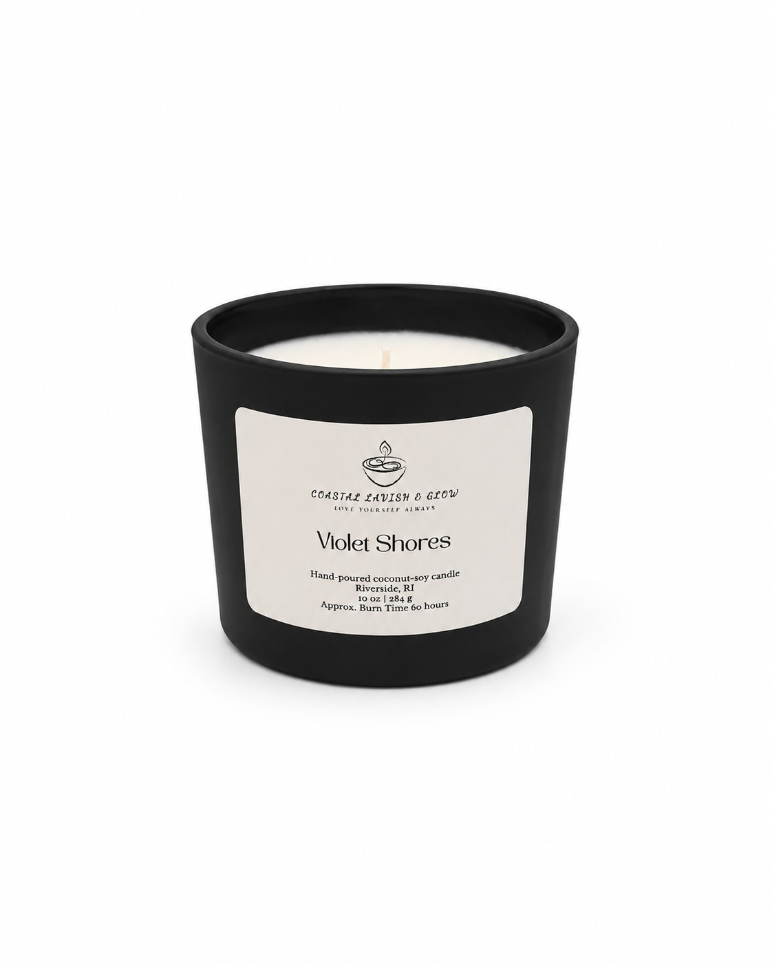 Black candle with a white label on a white background